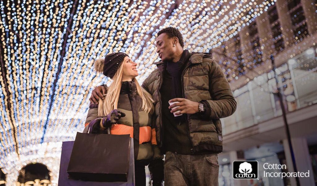 man and woman walking together under light canopy