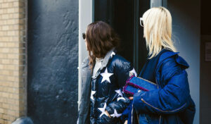 two women looking away from camera