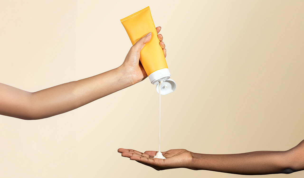 Home 1 beauty product recalls-sunscreen in hand